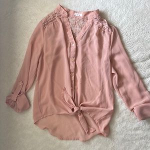 Dusty pink loose fitting blouse with flower cutouts in the back